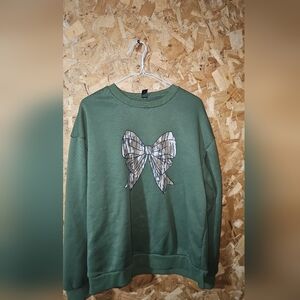 Green Sweatshirt with Camouflage Bow Graphic